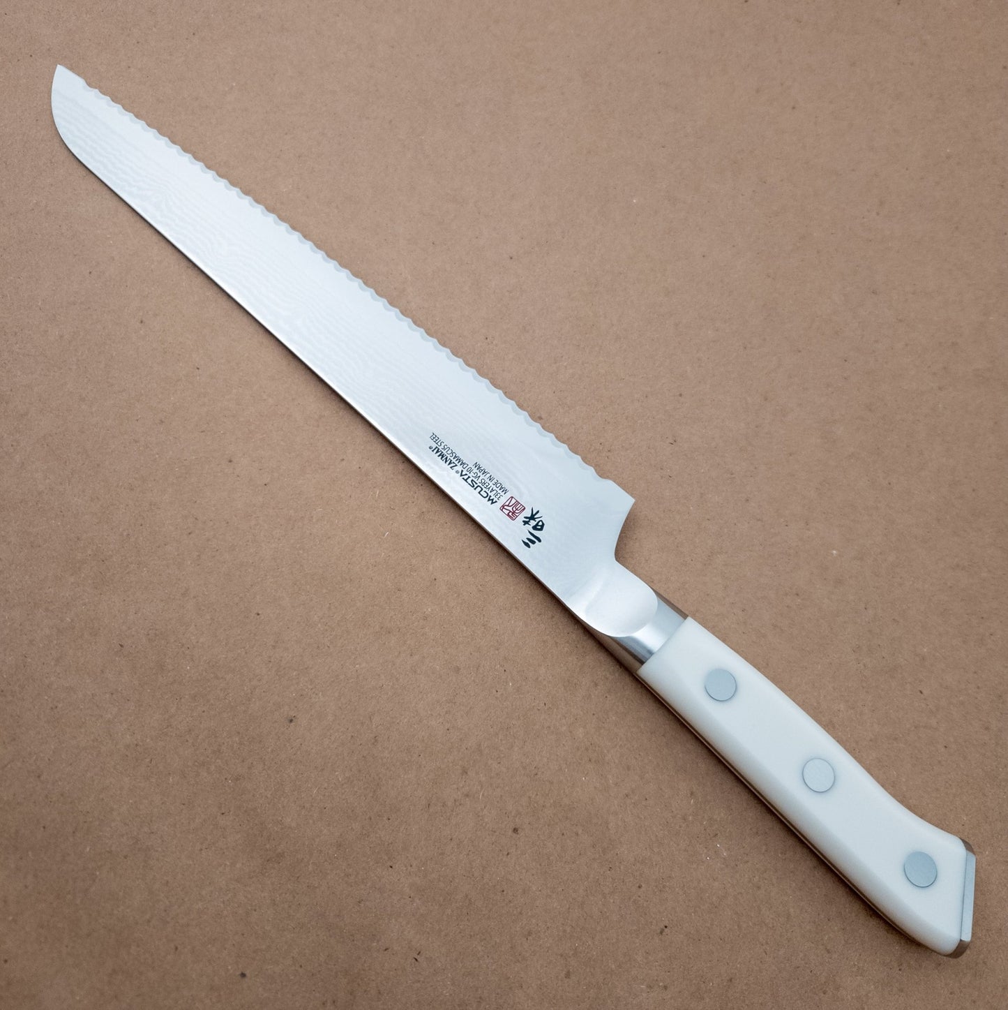 230mm MCUSTA ZANMAI Classic VG10 Damascus Bread Slicer Yo Handle - right side- District Cutlery