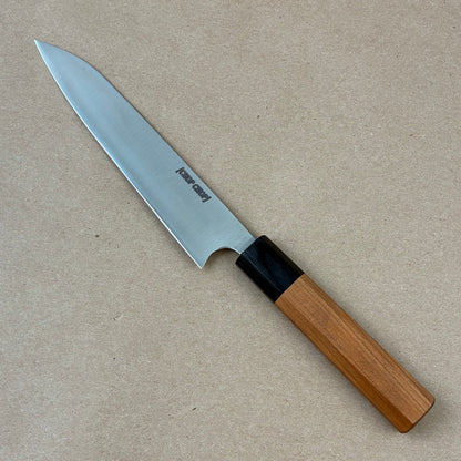 Knife with a wooden handle on a beige background