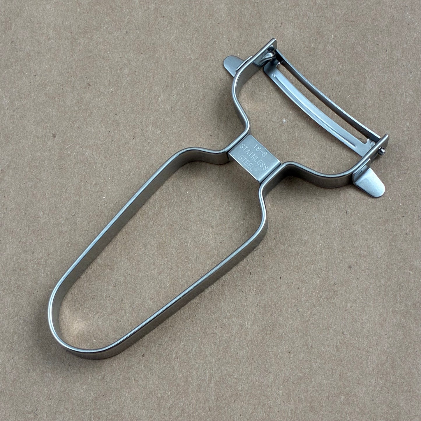 Curved stainless steel "Y"peeler