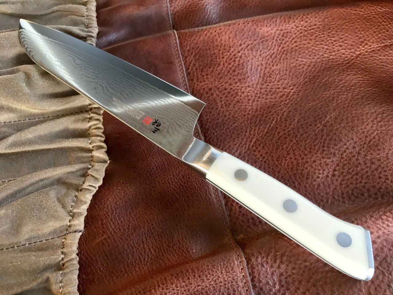 MCUSTA ZANMAI Santoku - Damascus Clad with Corian - District Cutlery